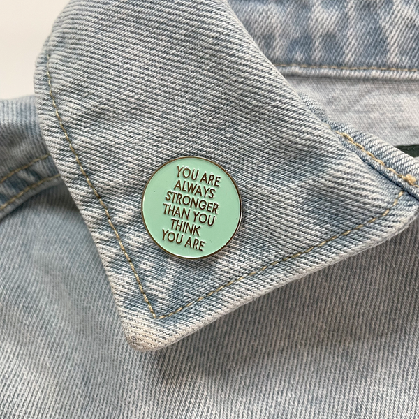 STRONGER THAN YOU THINK ENAMEL PIN